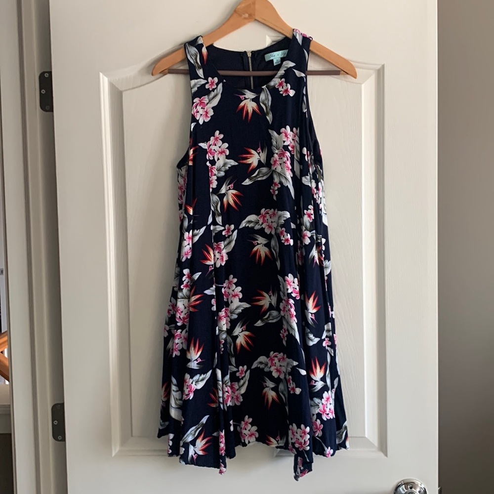 Cotton/polyester short sleeveless dress.  Navy blue floral print.